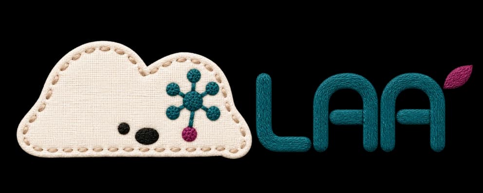 The LAA character and wordmark, rendered in embroidery